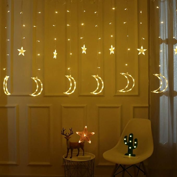 824007304882R67-1 شريط اضاءة مكون من 138 مصباح LED للتعليق بديكورات مزخرفة على شكل القمر والنجوم (لون ابيض دافئ، 138.5 متر) - الصورة 1